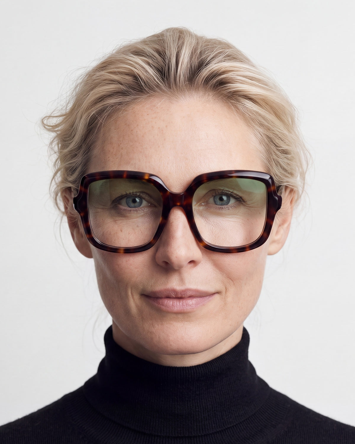 Elara in tortoiseshell, worn, Sage lenses